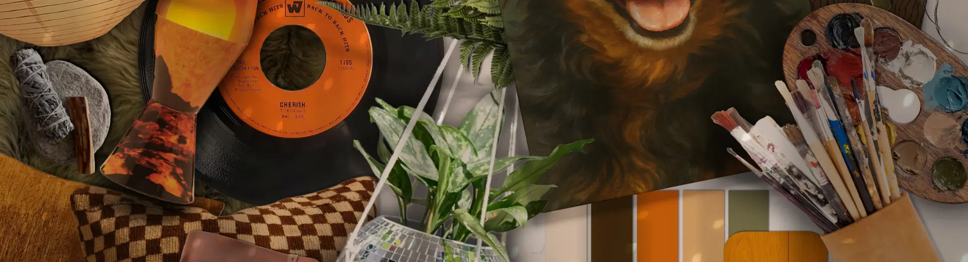 Flat lay with a dog painting, disco ball planter, vinyl record, earthy swatches, and warm-toned décor accents.