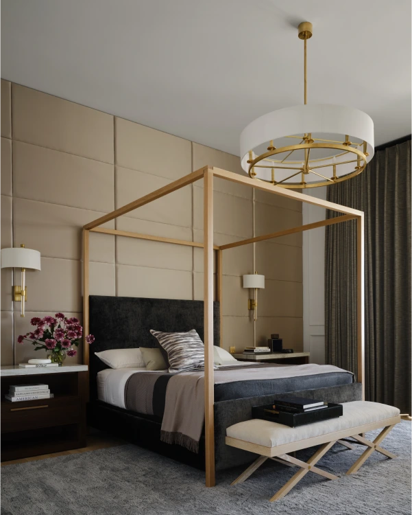 Modern bedroom from Grace Blu’s Some Like It Pop with gold canopy bed, tan walls, and mirrored dressers.