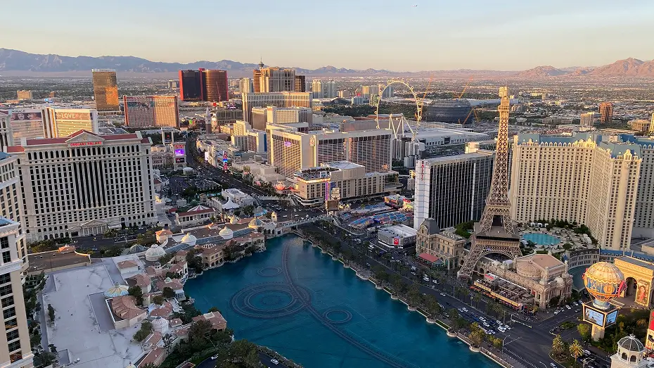 Aerial view of the Las Vegas Strip with famous hotels, fountains, and replica Eiffel Tower at sunset, captured for Grace Blu Interior Design