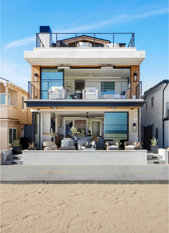 Exterior shot of Grace Blu's Interior Design The Happy Place Project. Ocean-front beach house with three stories