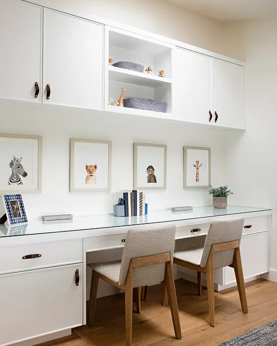 Park Ave office with long white desk, overhead cabinetry, and two wood chairs in a clean white space.