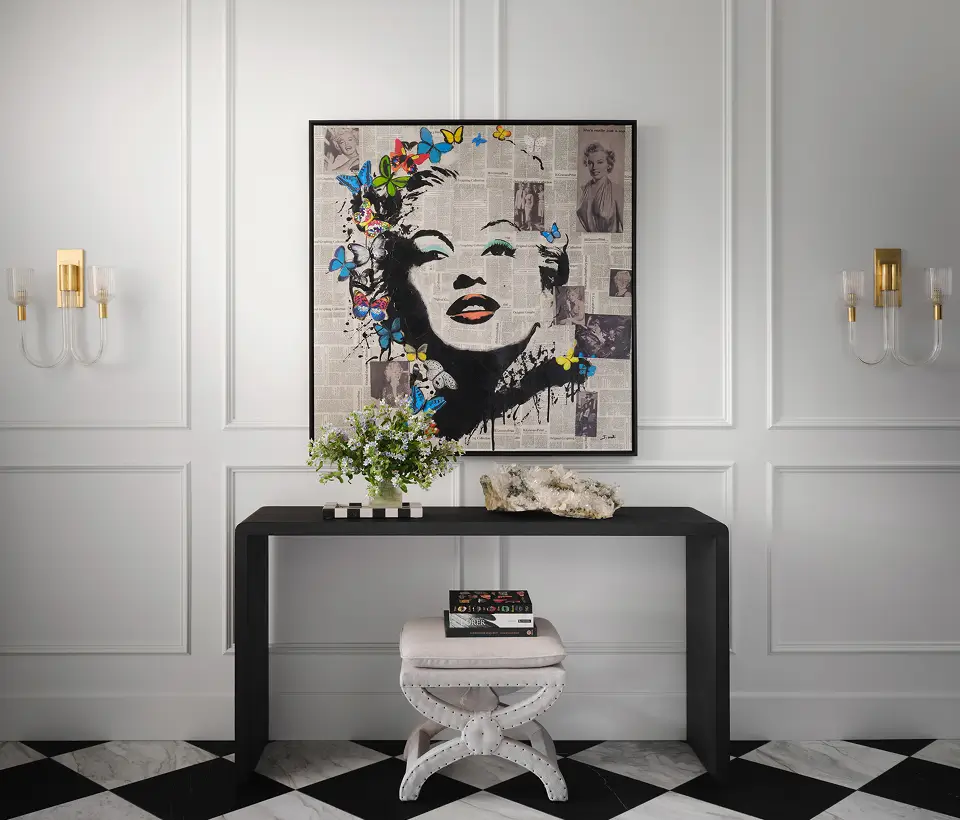 Wall mural of Marilyn Monroe with bold makeup smoking beside a drink.